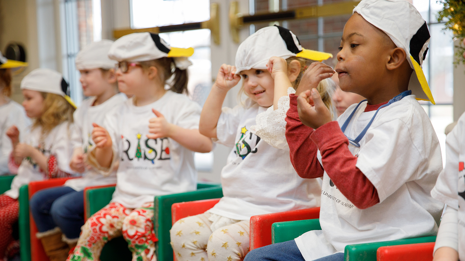 A group of small children take part in a class activity